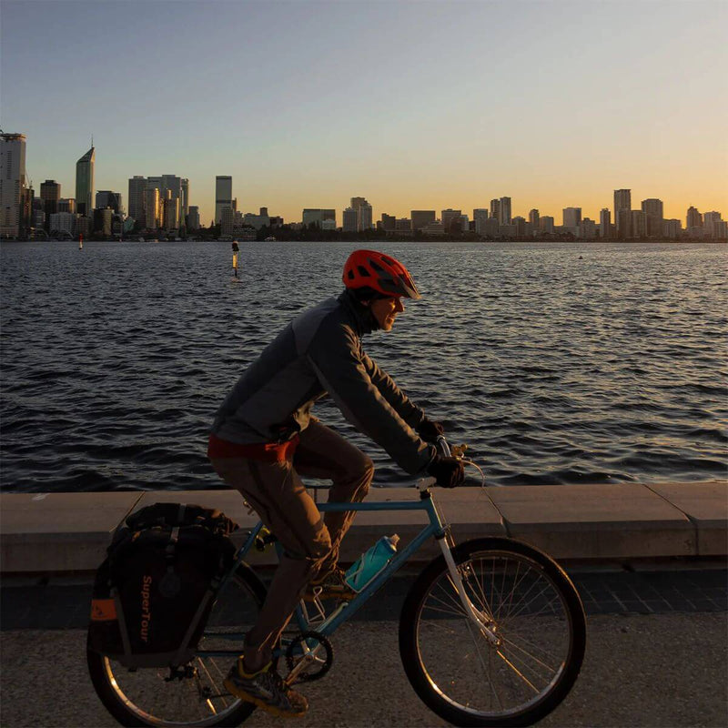 product manager cycling along the river